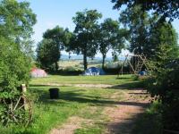 This picture shows the entrance of the small and cozy camping Les Tournesols de Beaulieu.