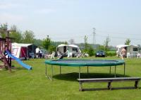 Trampoline and pitches on Camping Polderhoek.